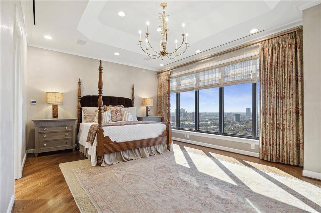 Sleep soundly in the expansive owner’s suite featuring a tray ceiling, brass chandelier and a wide west-facing window with Hunter Douglas shades.