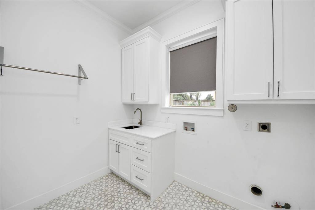 The downstairs utility room offers plenty of space for all of your laundry needs, and also features a sink area and lovely window for natural light! There is also a pre-plumbed optional second utility room upstairs!