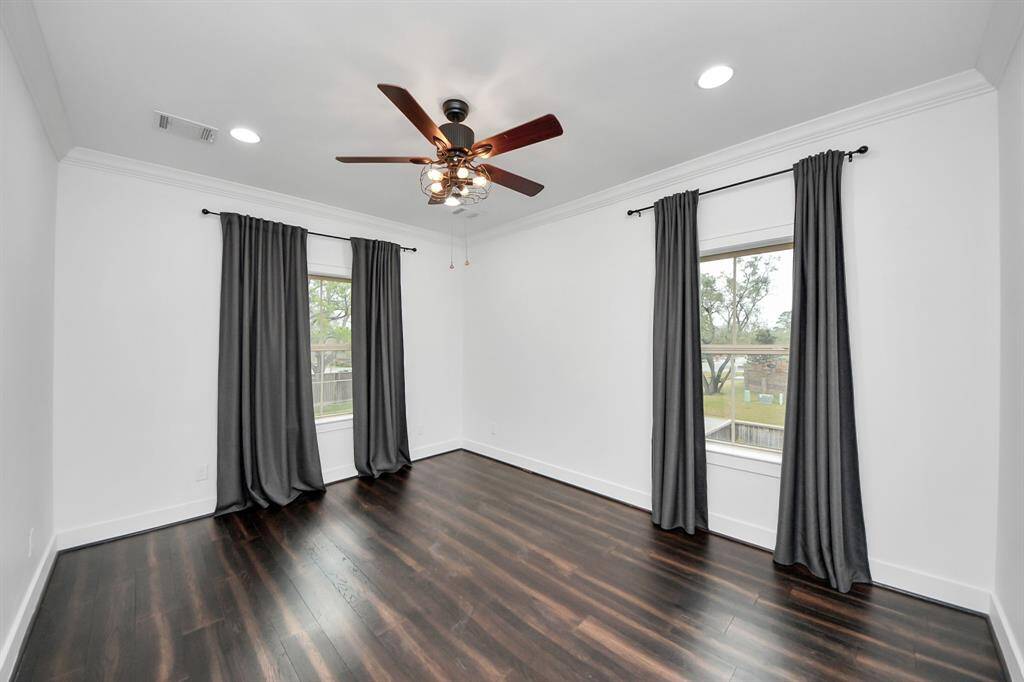 This is the second of four bedrooms upstairs, and this 14'8" x 11'7" room also features lovely views, hardwoods, its own ensuite bathroom and a walk-in closet!