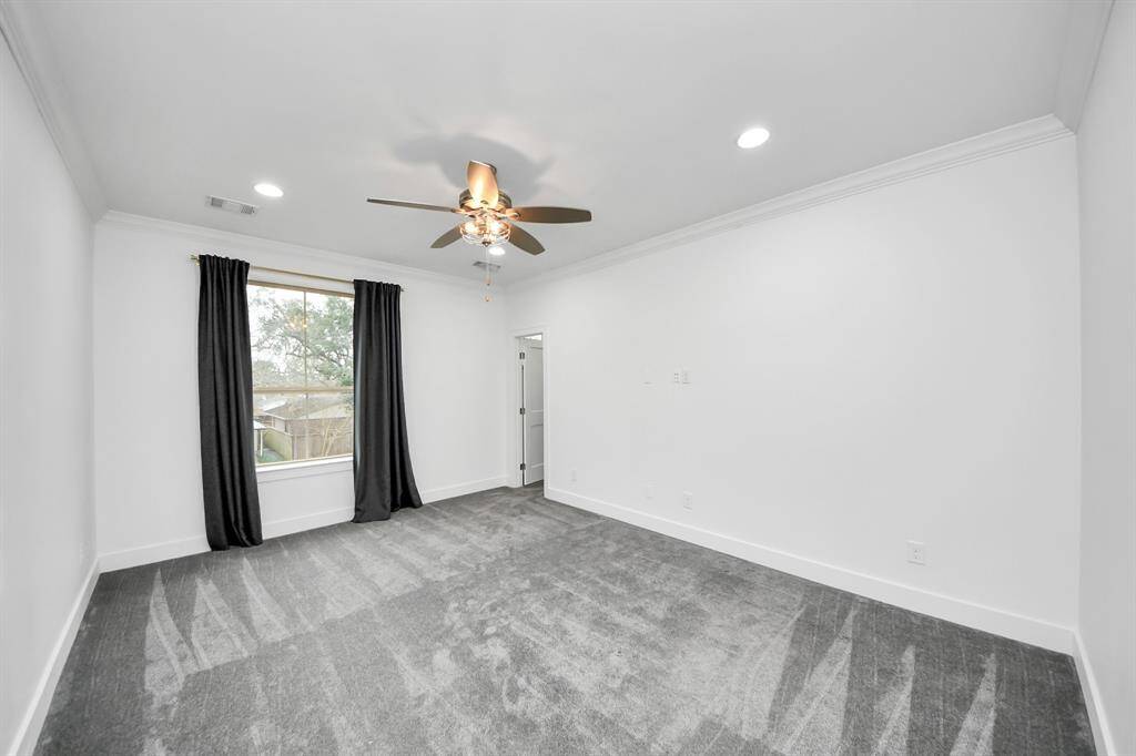 Here we see the third of four upstairs bedrooms - a lovely and bright 18' x 11'11" room with a beautiful view and a walk-in closet!