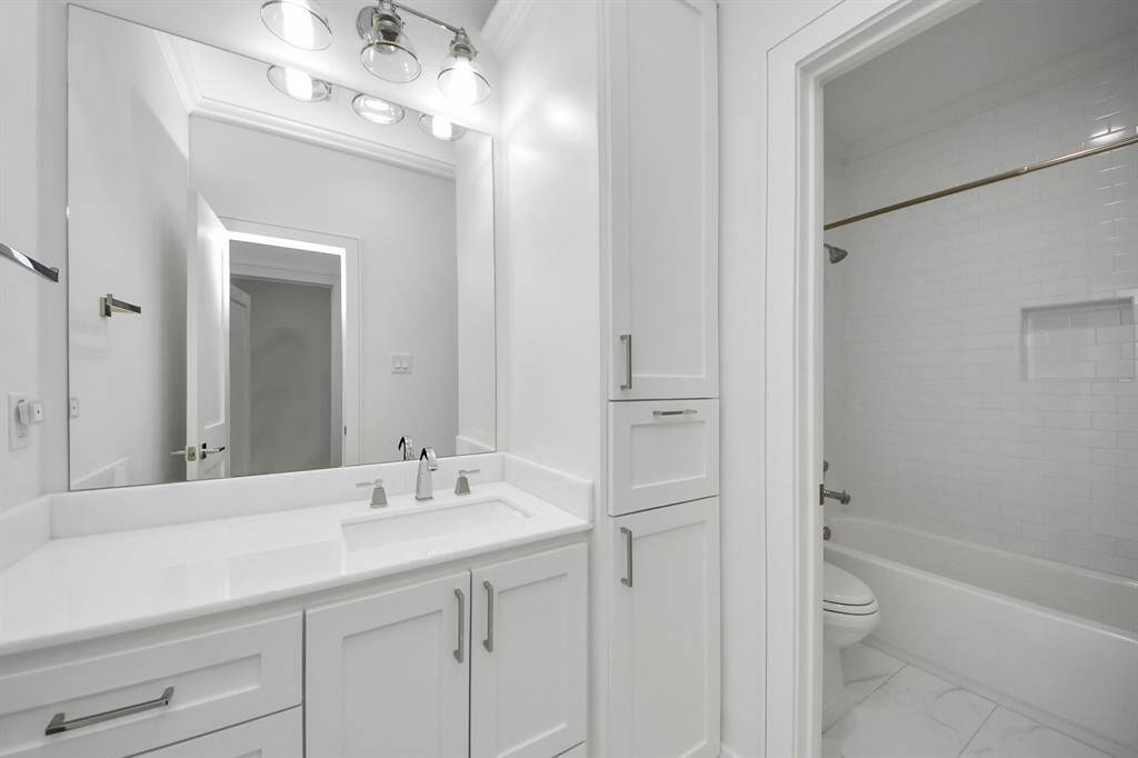 This beautiful full bath is shared between the third and fourth bedrooms upstairs. The fixtures and features mirror those of the two upstairs ensuite baths for design continuity!