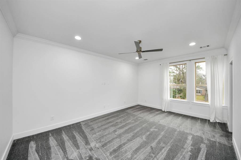 The fourth secondary bedroom upstairs, 17'5" x 14'7", is also lovely and bright, and also features its own walk-in closet!