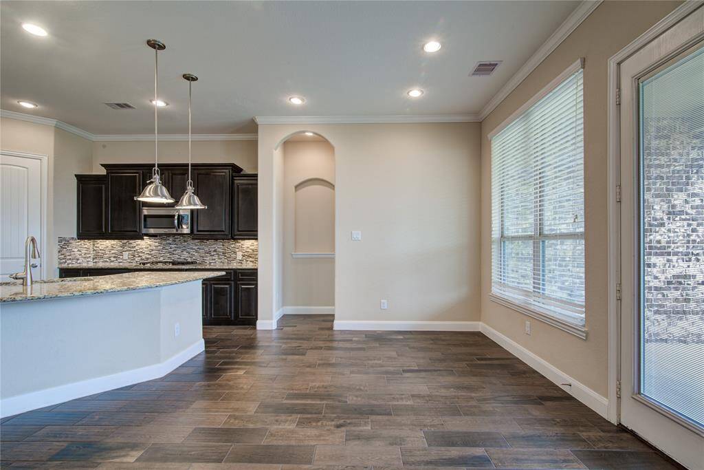 The breakfast room sits adjacent to the kitchen and living rooms, and is large enough to hold a table for 6 or 8.