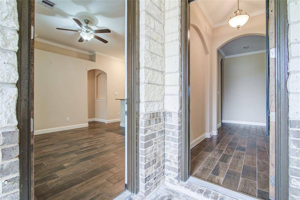 Returning to the front porch, you can see that the two front doors lead to you to the two separate parts of the house.