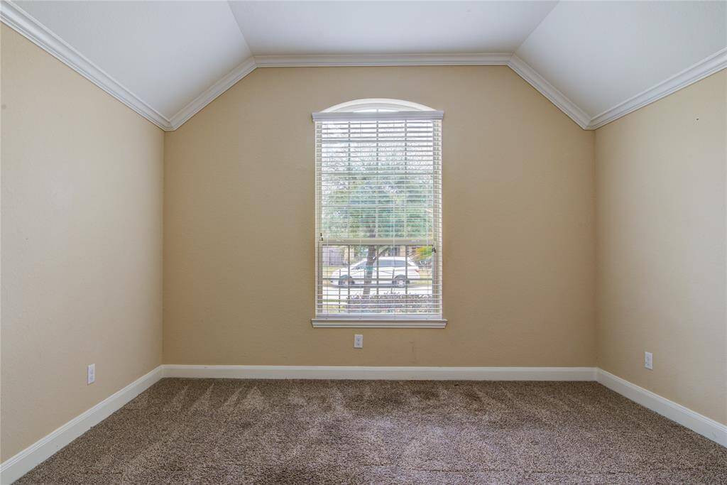 Bedroom 4 in the apartment is large and has crown molding.