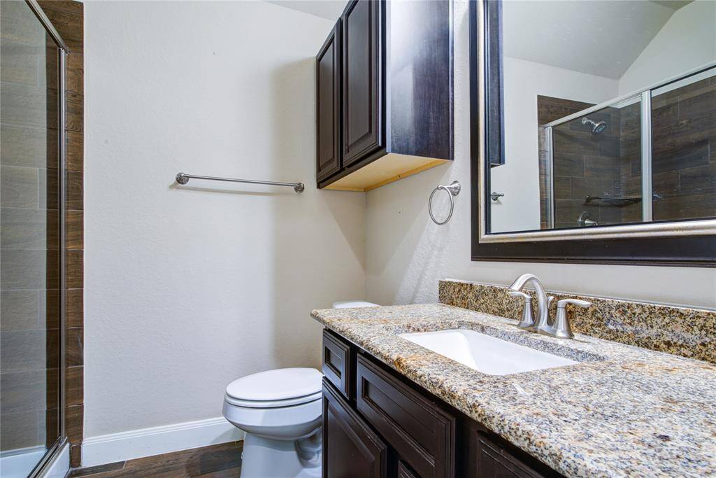 Bathroom 3 in the apartment has a large walk-in shower.