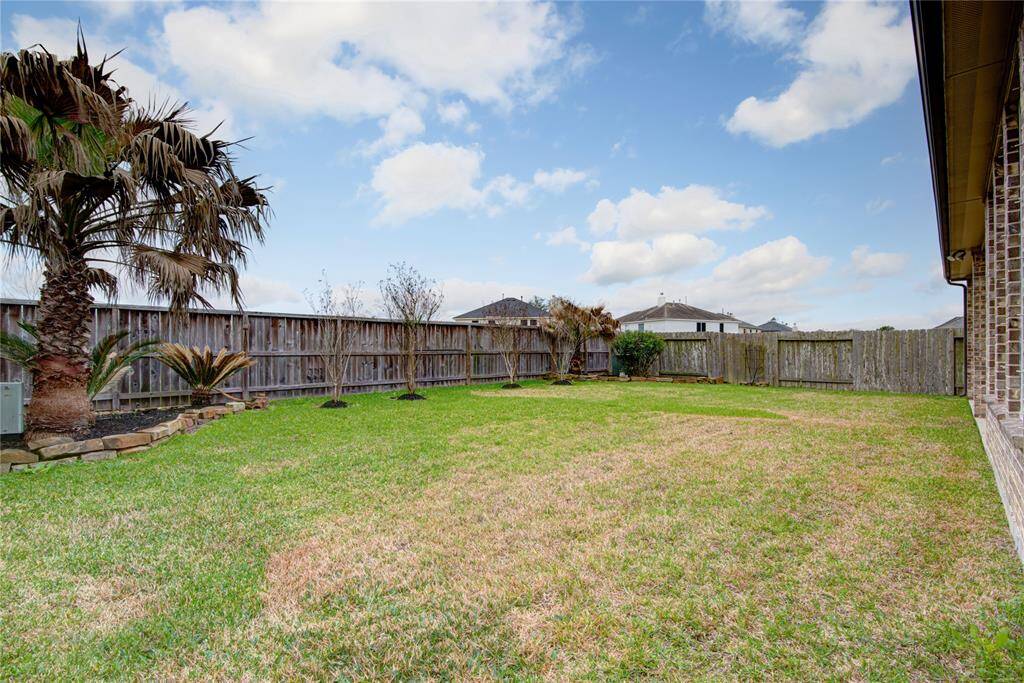 The large yard has a sprinkler system and also plenty of room for all of the ways you like to spend time outdoors.
