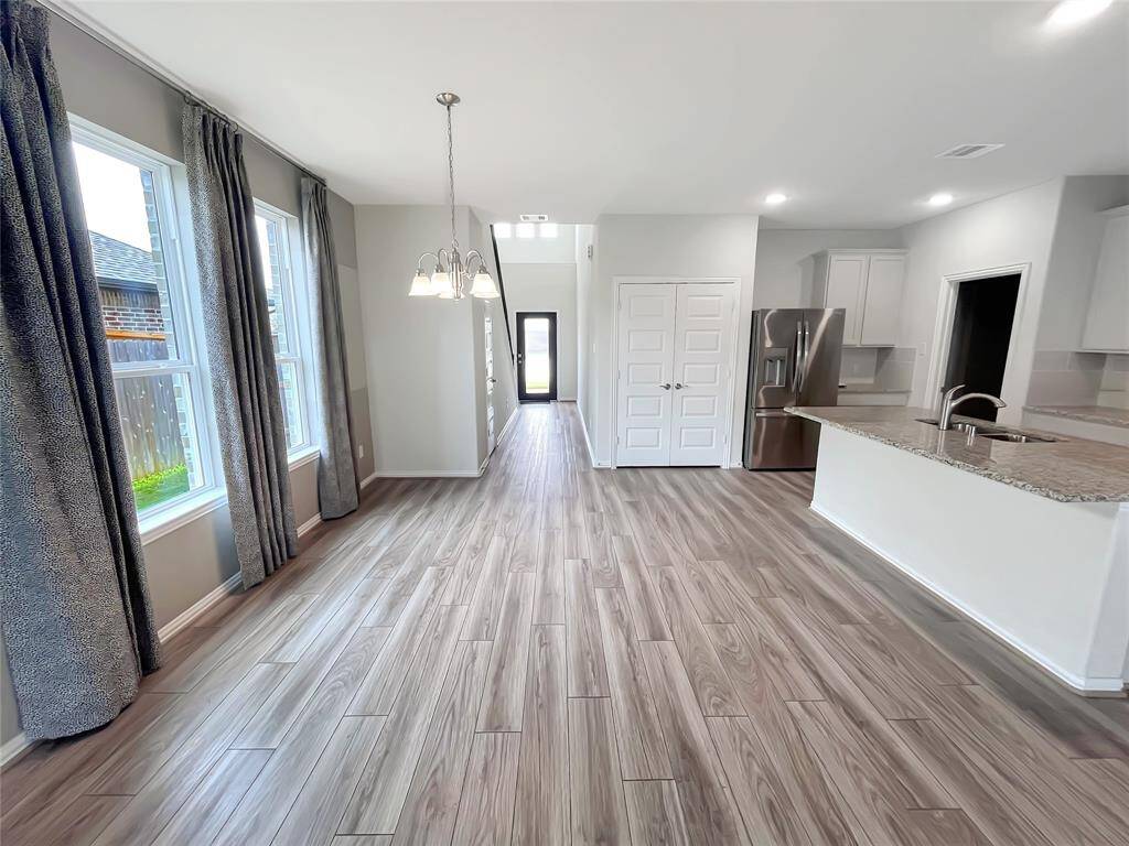 The Robi- Family Room into the Dining Area and Kitchen.