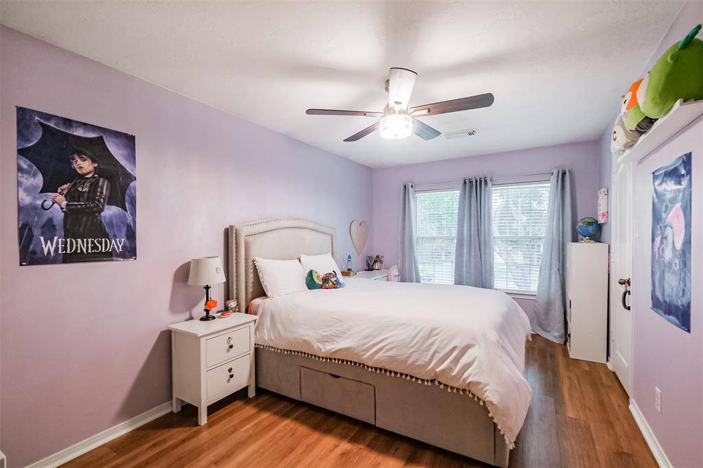Guest bedroom #1 sits in the front of the home. Recent flooring and paint. Ceiling fan. 17 x 10.