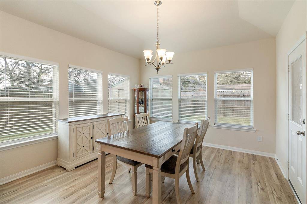 Prepare to enjoy meals with a view in this charming dining room (14x13) featuring corner windows that flood the space with natural light & offer a glimpse of the backyard space.