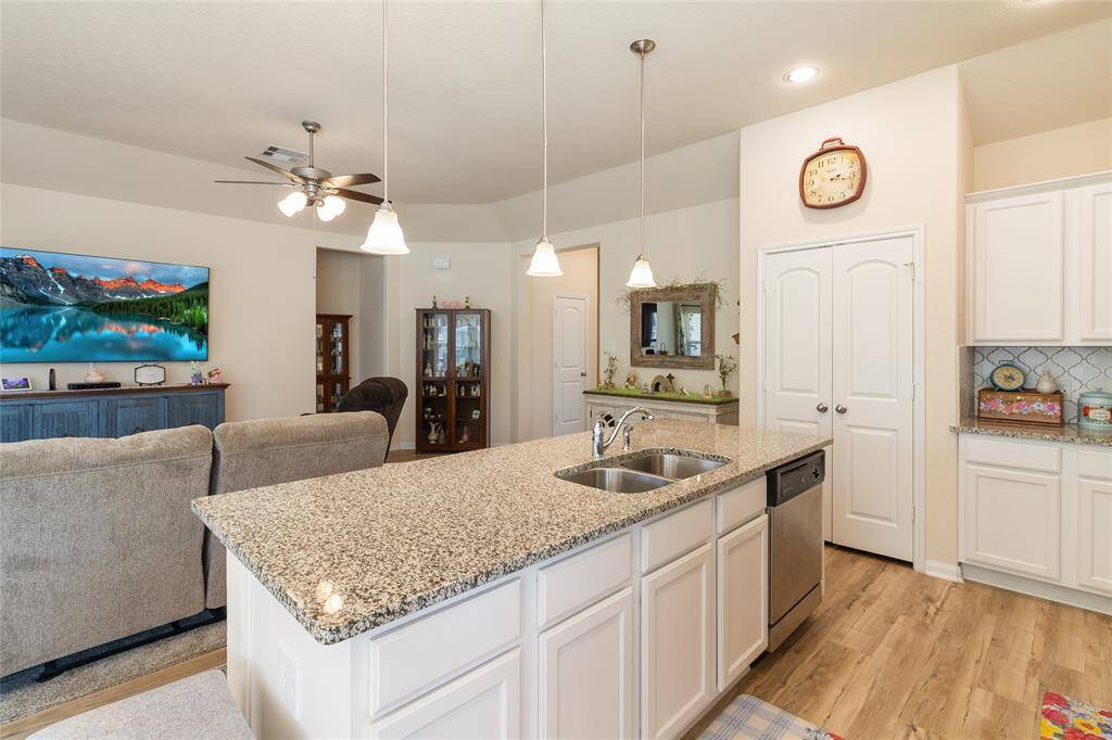 Designed for both style & function, this kitchen features sleek stainless steel appliances, ample prep and counter space & convenient pantry storage, making meal prep and organization a breeze.