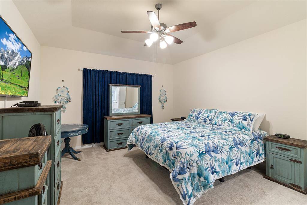 Oversized primary bedroom (15x14) offering plenty of room to comfortably accommodate multiple larger furniture pieces, making it the perfect retreat for relaxation & personalization.