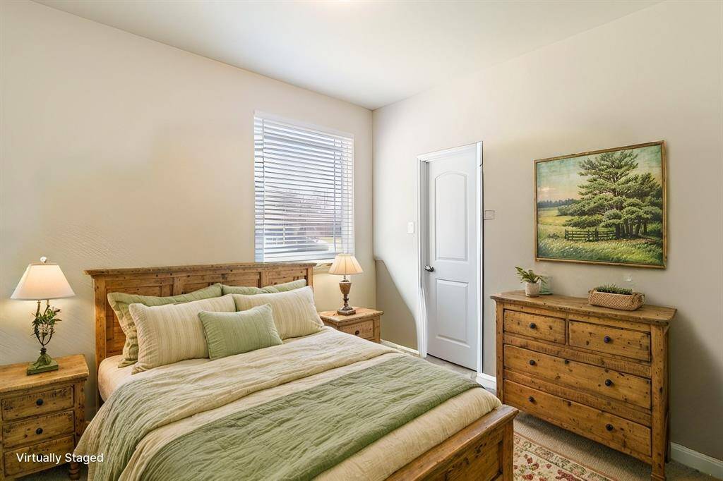 Bedroom #3 offering high ceilings (11x10) & a large walk-in closet. This room overlooks the front yard with a large window allowing an abundance of natural sunlight.
