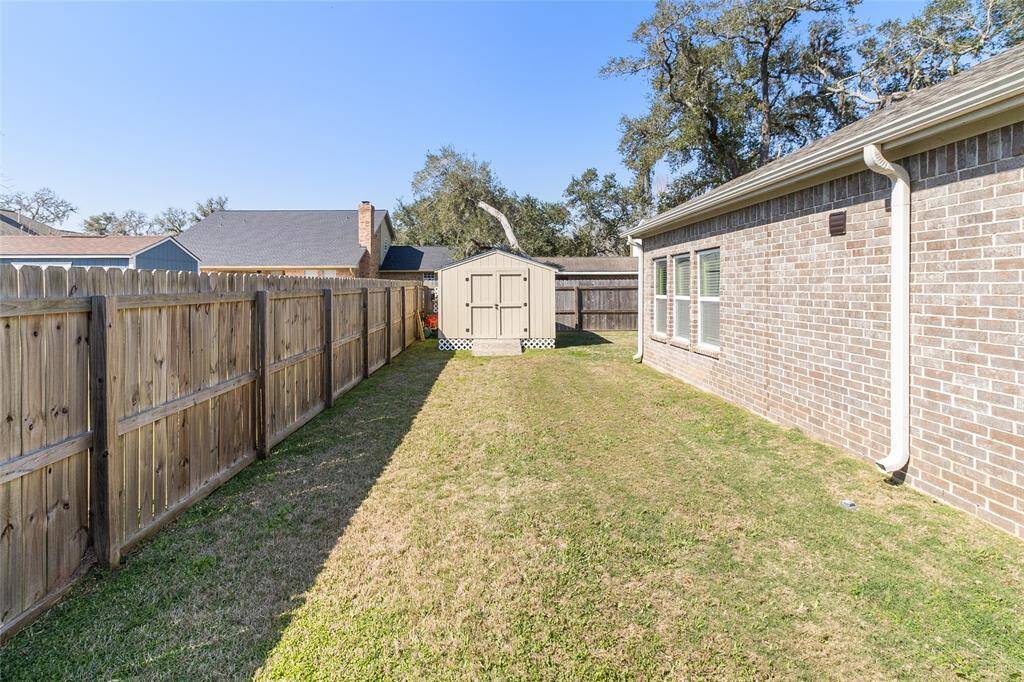 Extended, fenced side yard offers ample green space, providing a perfect area for pets to roam & play while still offering privacy with the surrounding fencing.