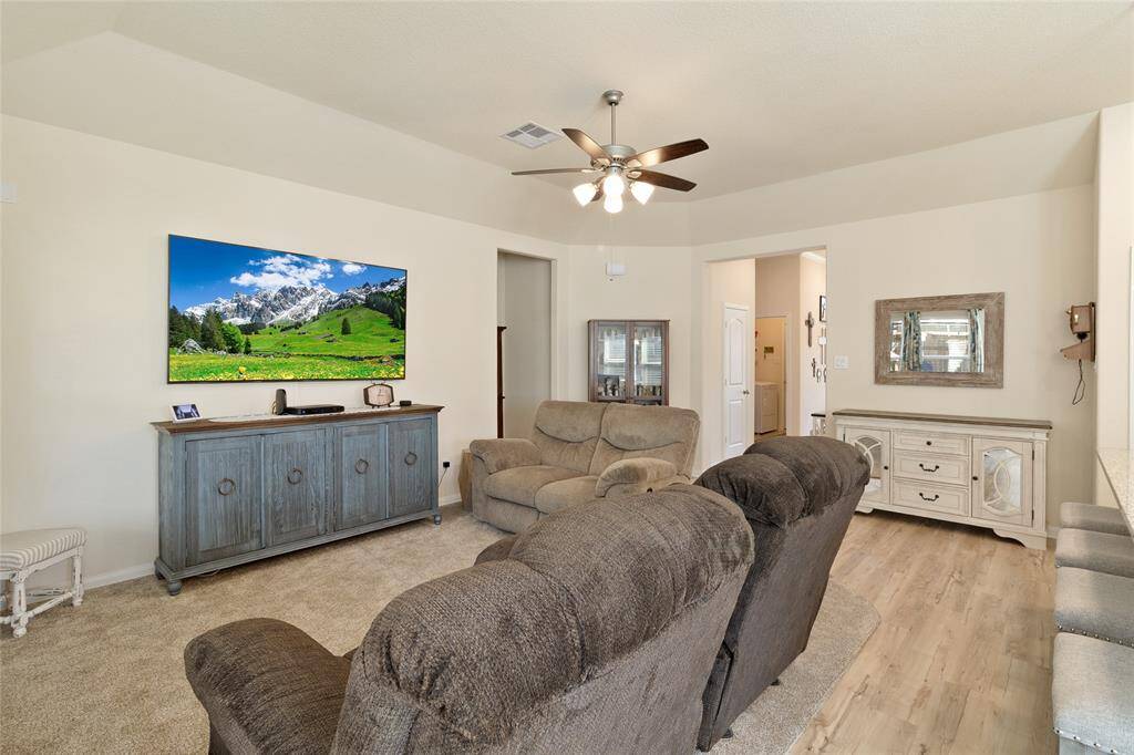 Great sized family room (19x15) with recently added plush carpeting creating a soft & cozy space, perfect for unwinding or enjoying time with loved ones.