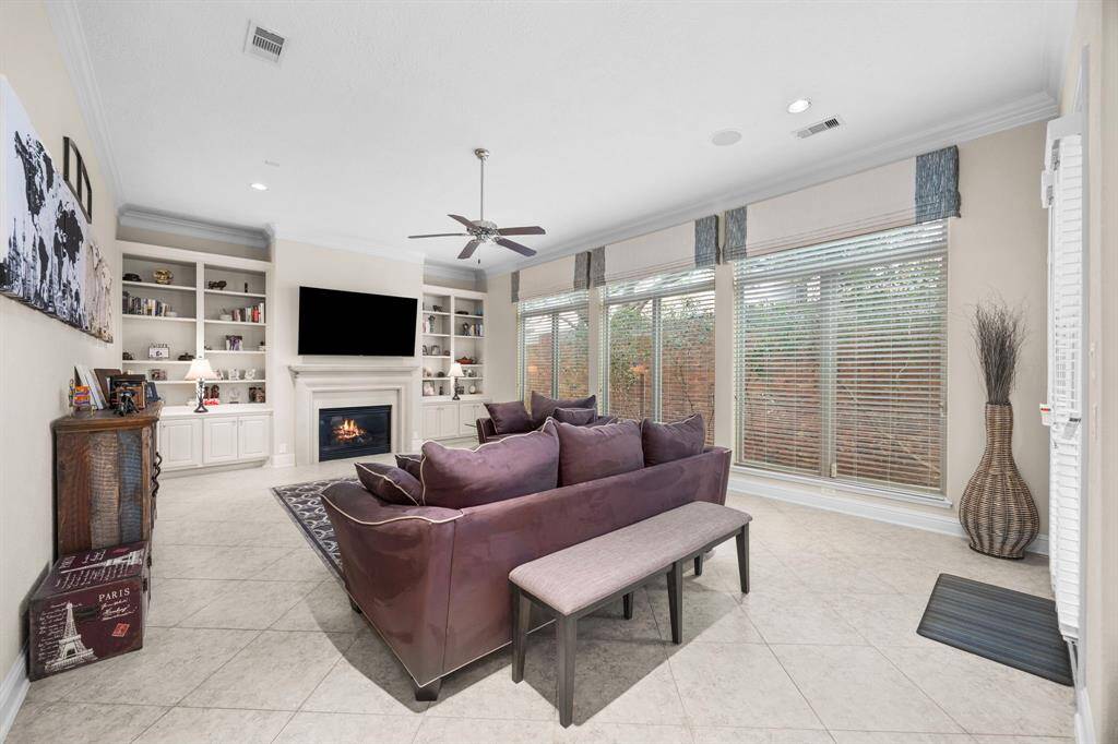 The massive main living room features built in storage and a gas fireplace.