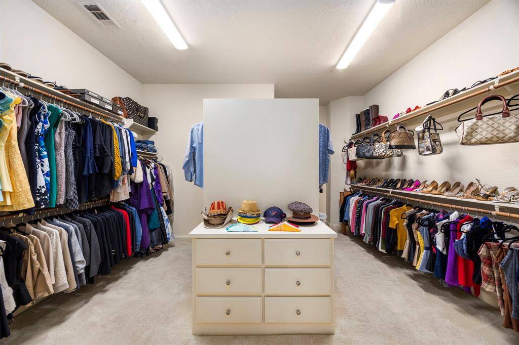 The master closet is a sight to see with impressive room and storage options on both sides.