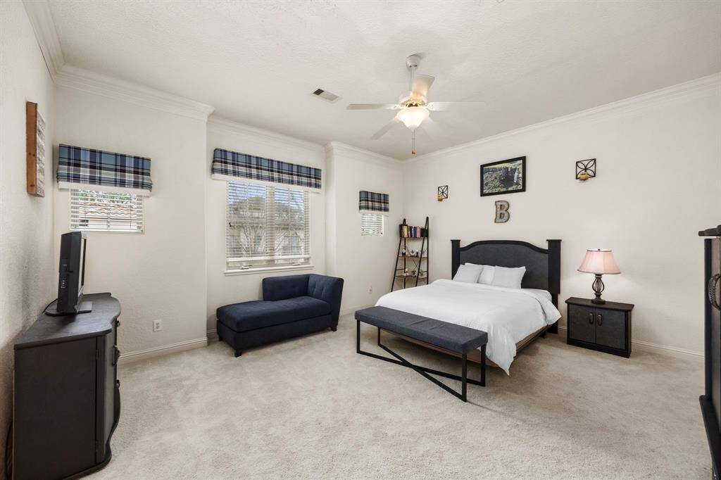 Secondary bedroom #2 also offers high ceilings, a huge walk in closet and is own en-suite bath.