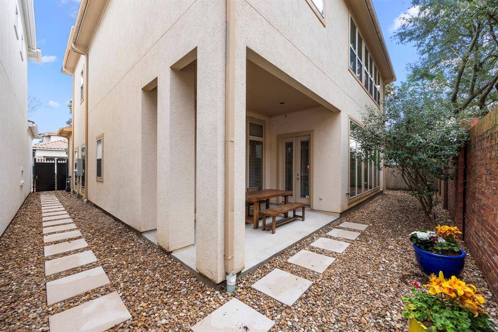 Large pavers provide an easy path from the back of the home all the way to the front yard.