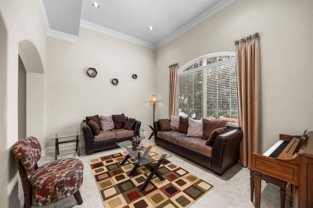 The spacious formal living area could easily be converted to a home office. This room overlooks the front yard.
