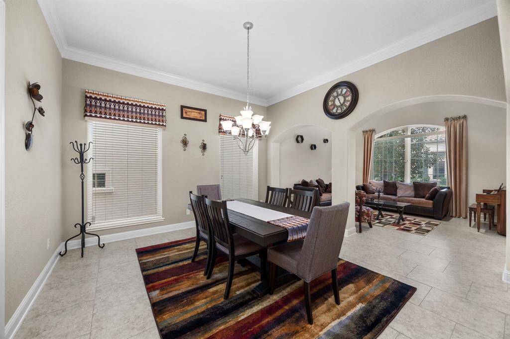 The dining room features access to the kitchen & a pair of large windows providing incredible natural light.