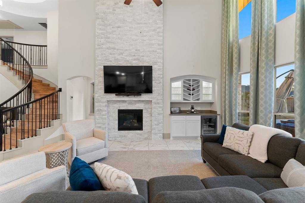 Cozy seating area and a built-in dry bar, perfect for entertaining.