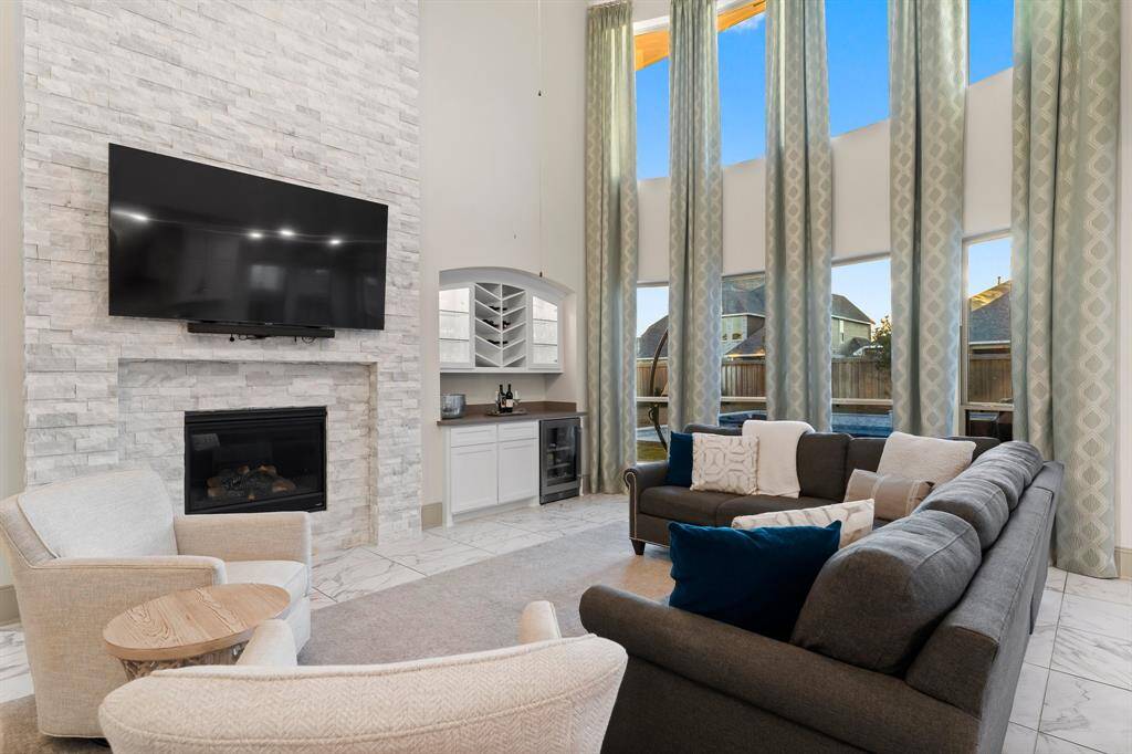 Flooded with natural light from grand windows.