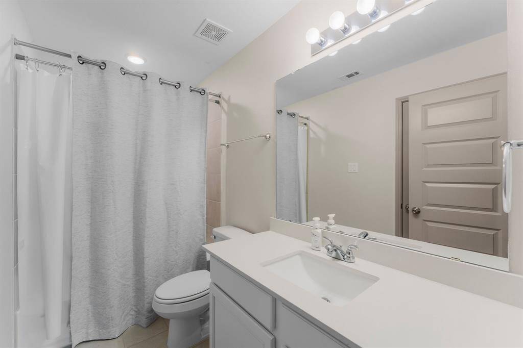Private bath attached to the third bedroom.