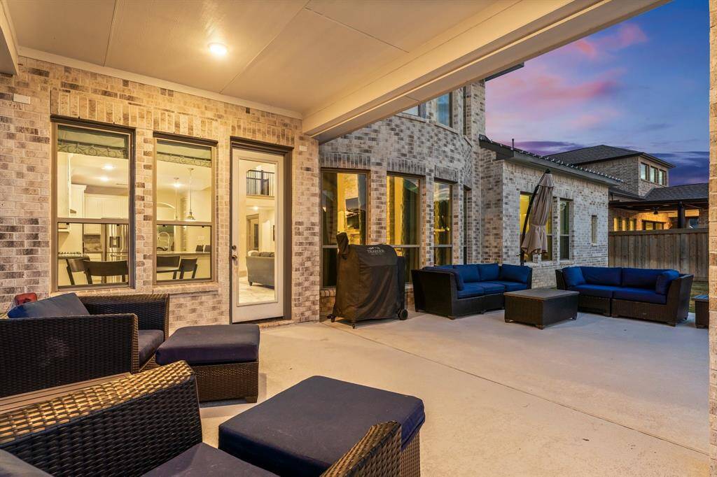 Large covered patio area with plenty of space for outdoor seating.