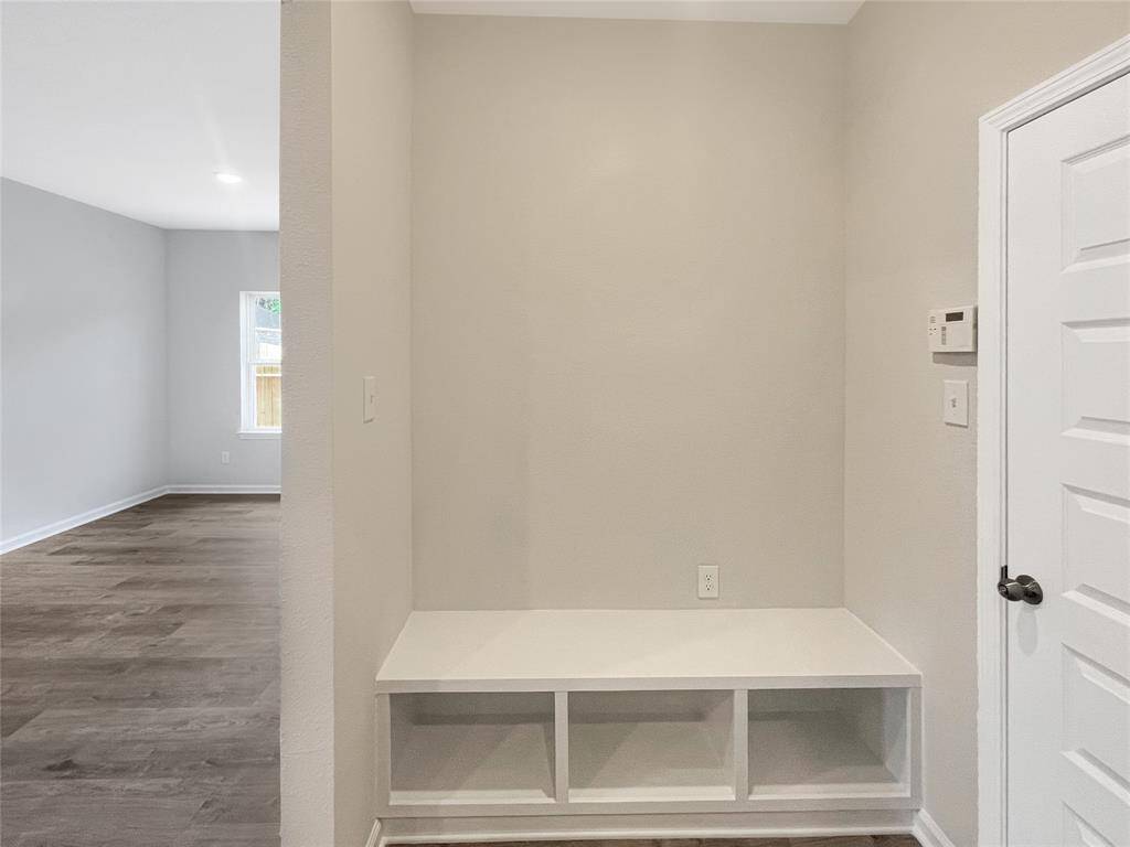 The Sparrow II- Mudroom at Garage Entry with Bench.