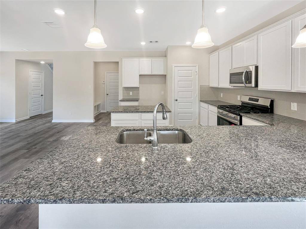 The Sparrow II- The Kitchen with Serving Bar and Island.