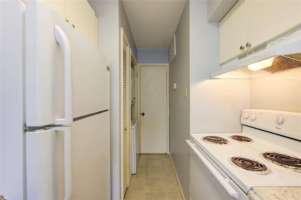 Kitchen view with utility room