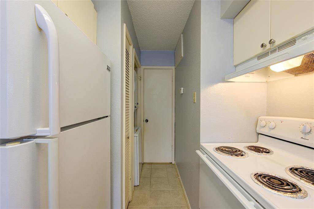 Kitchen view with utility room