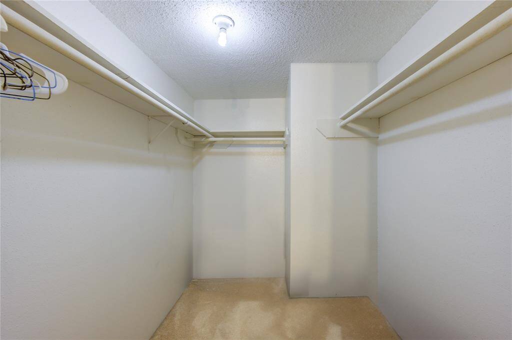 Walk-in closet in primary bedroom