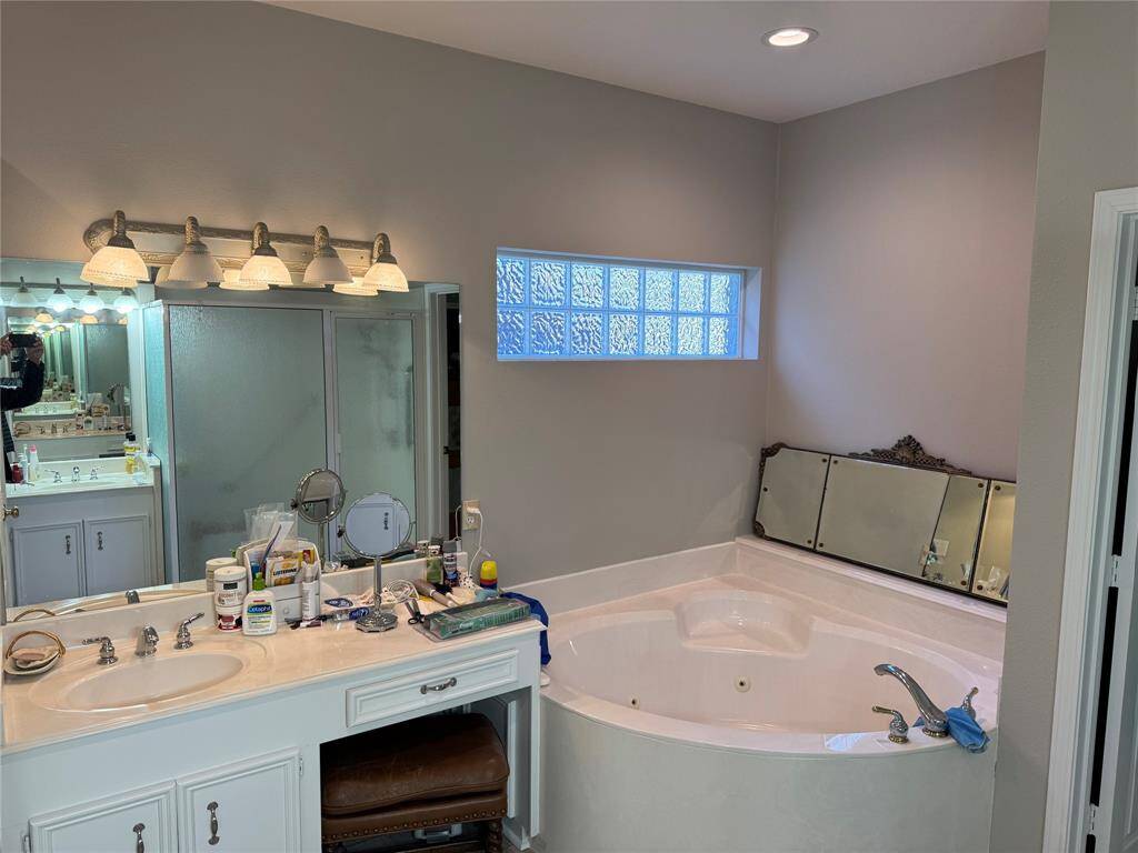 Large Primary Bath with jetted tub and vanity area.