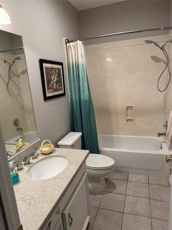 2nd bath with updated granite countertops and tile floors.