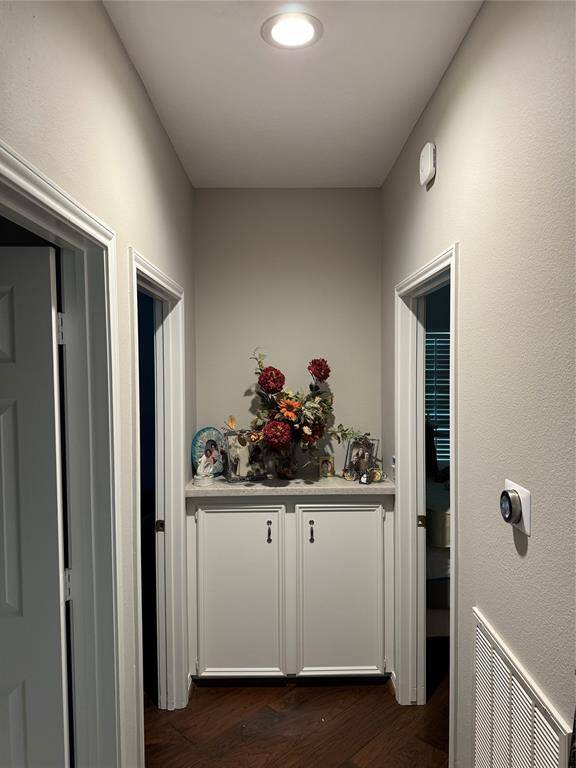 View of built-ins in hallway between 2nd and 3rd bedrooms