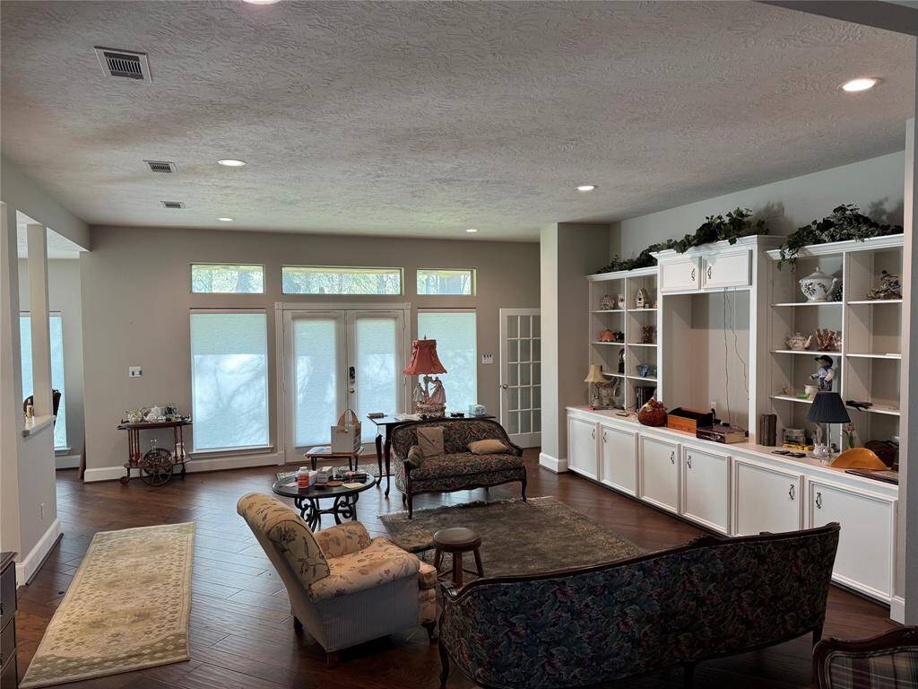 View of Living Room. Note the built-ins and lots of natural light.