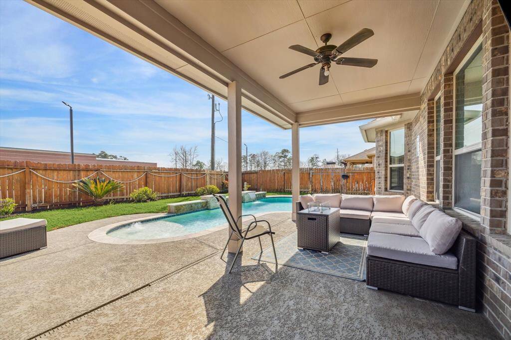 Outside is your oasis - sparkling pool (katchakid pool cover included), covered patio, and more