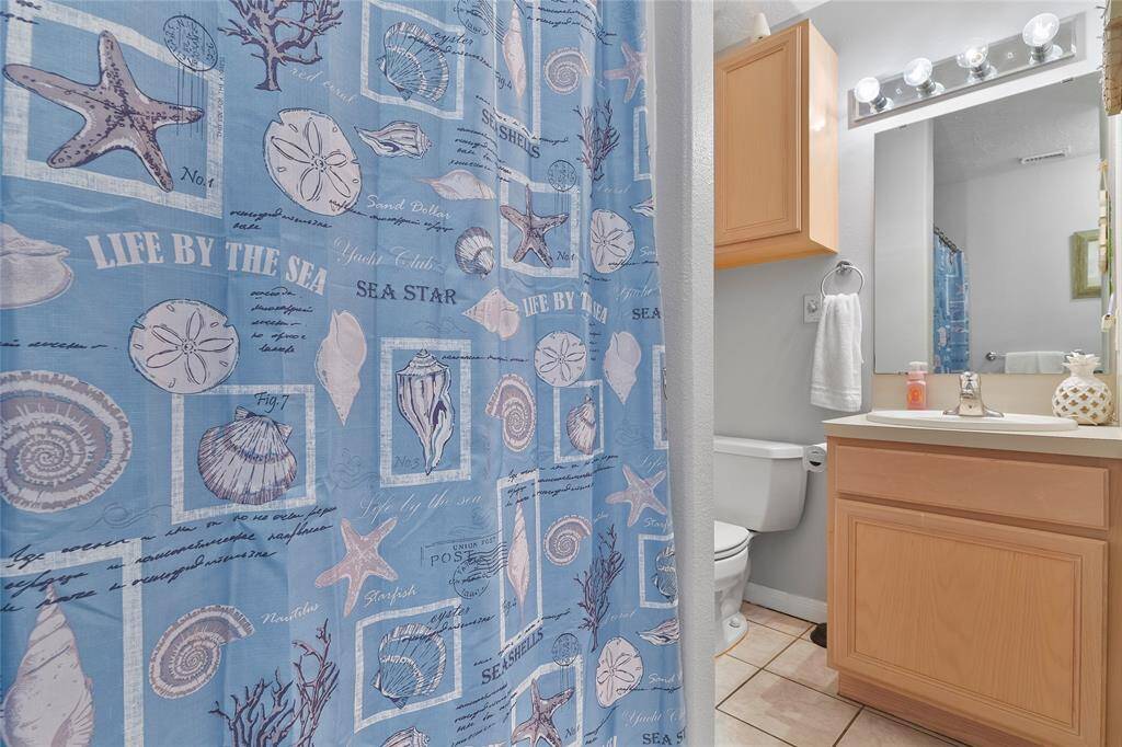 Conveniently located down the hall is the secondary bath with a tub/shower combination.