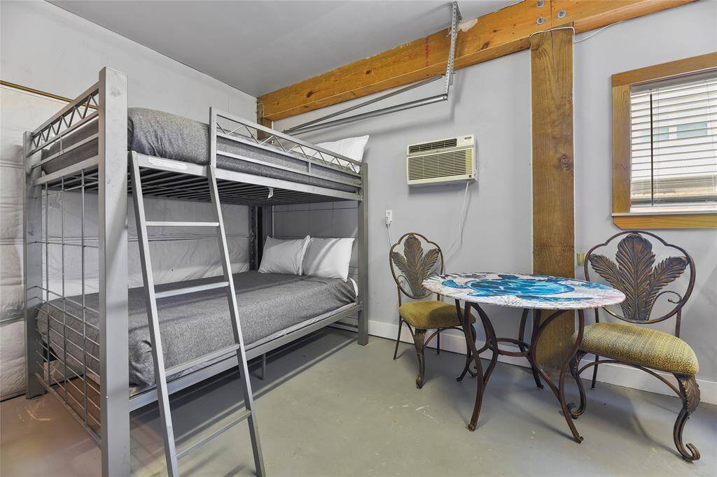 There are two sets of bunks, and a game table.