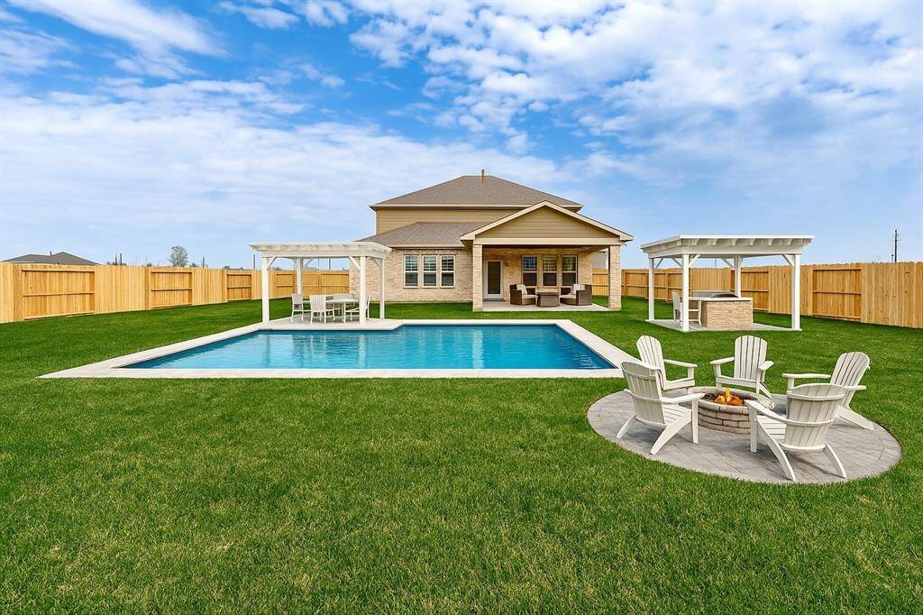 Enjoy outdoor living at its finest with this huge backyard! Whether you're looking to build a playground, garden, or pool, this space offers endless opportunities. The covered patio is perfect for hosting summer BBQs or unwinding with a morning coffee while enjoying the scenic view.