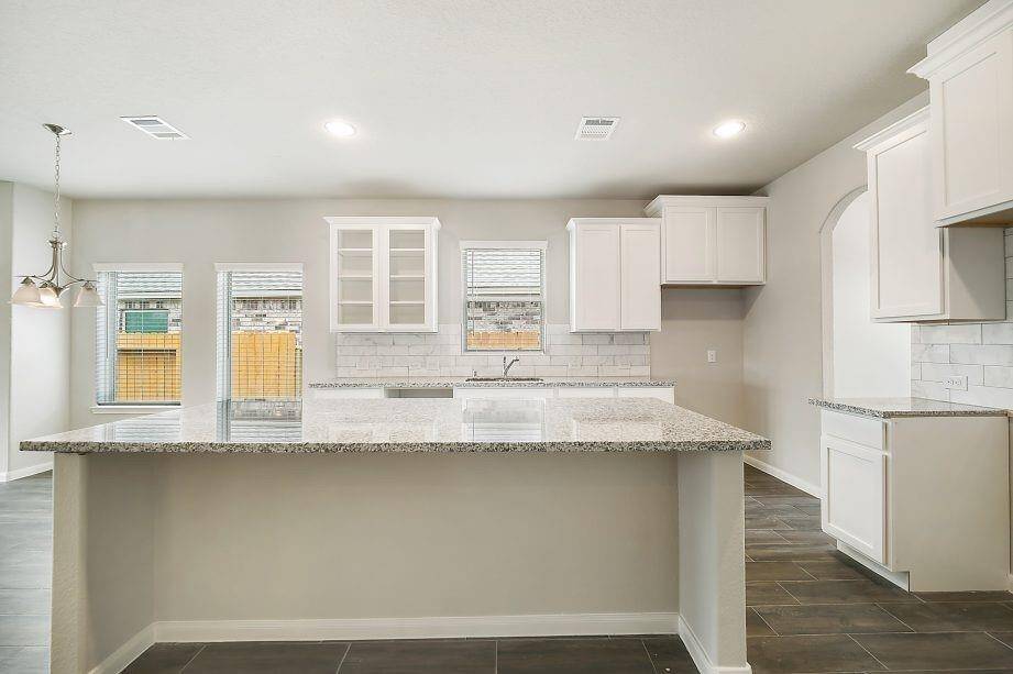 Step outside to an oversized backyard, offering endless possibilities for outdoor living. Whether you envision a play area, garden, or future pool, this fully fenced space provides both privacy and tranquility. The covered patio is perfect for al fresco dining or relaxing with a morning coffee.