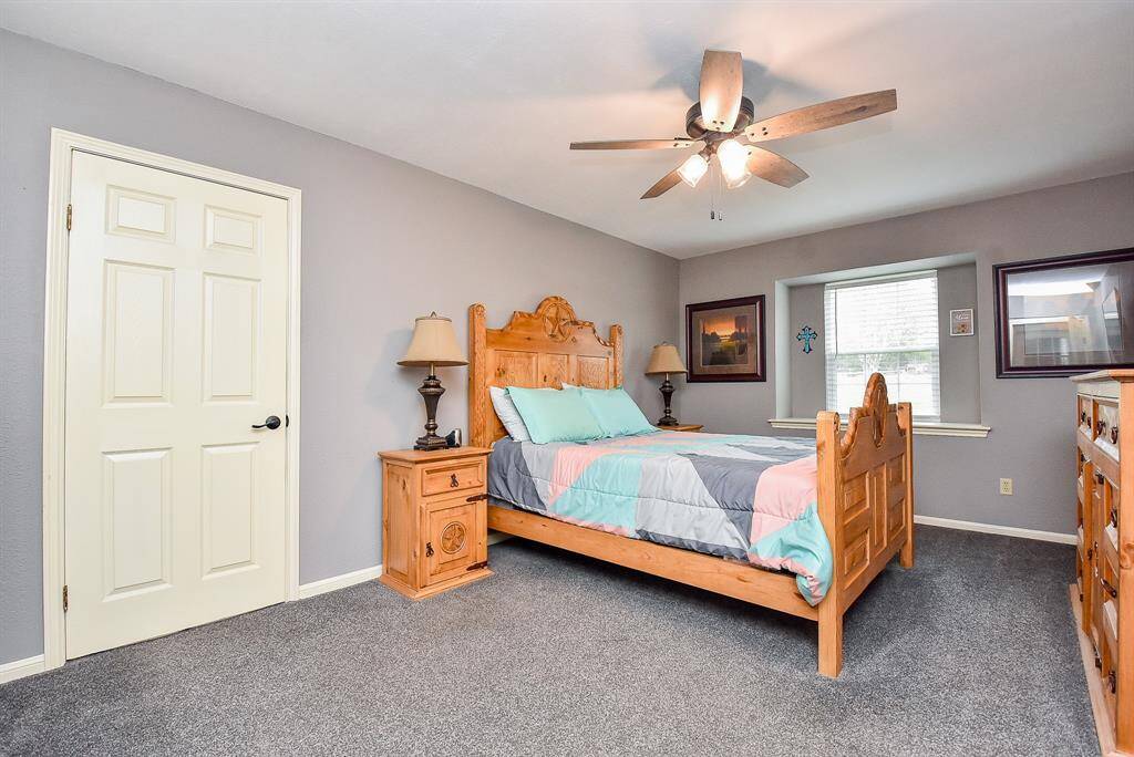 Here's another spacious carpeted secondary bedroom, with lovely natural lighting.