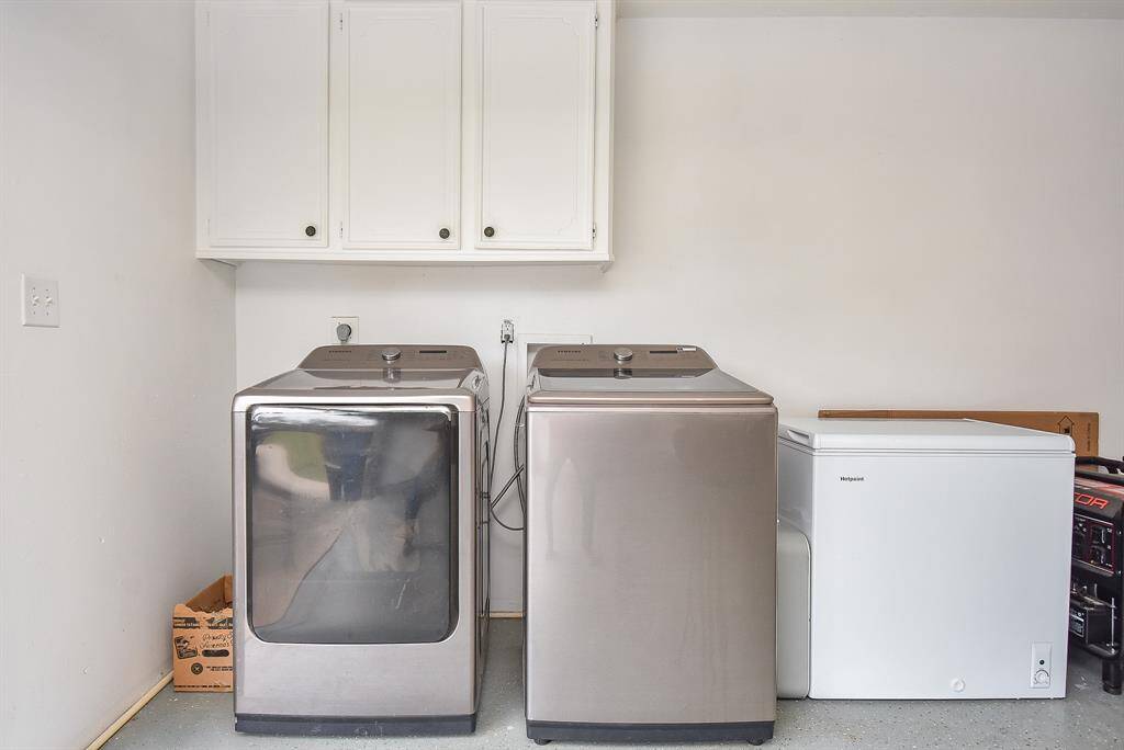 Even your pristine utility room is ready and equipped with hook-ups for laundry appliances and storage appliances, as well; with handy cabinet storage above.