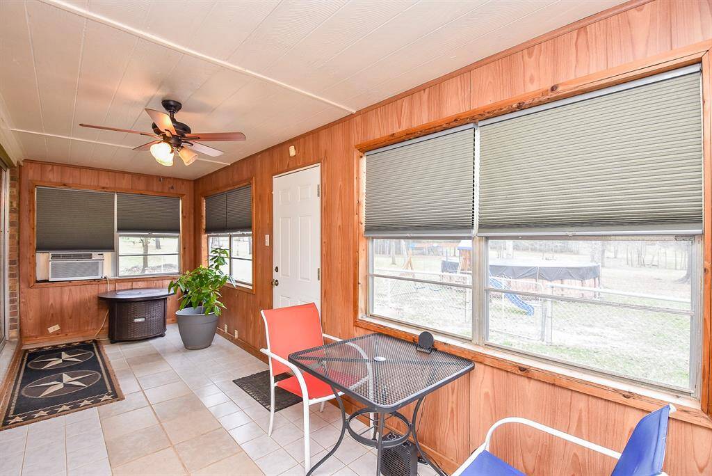 This enclosed sunroom/patio offers a welcomed way to embrace nature from the inside!