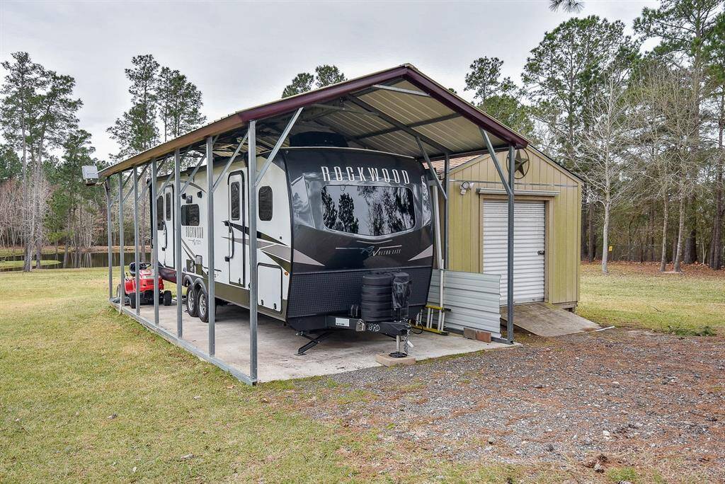 The handy detached carport shelters just about every type of vehicle.