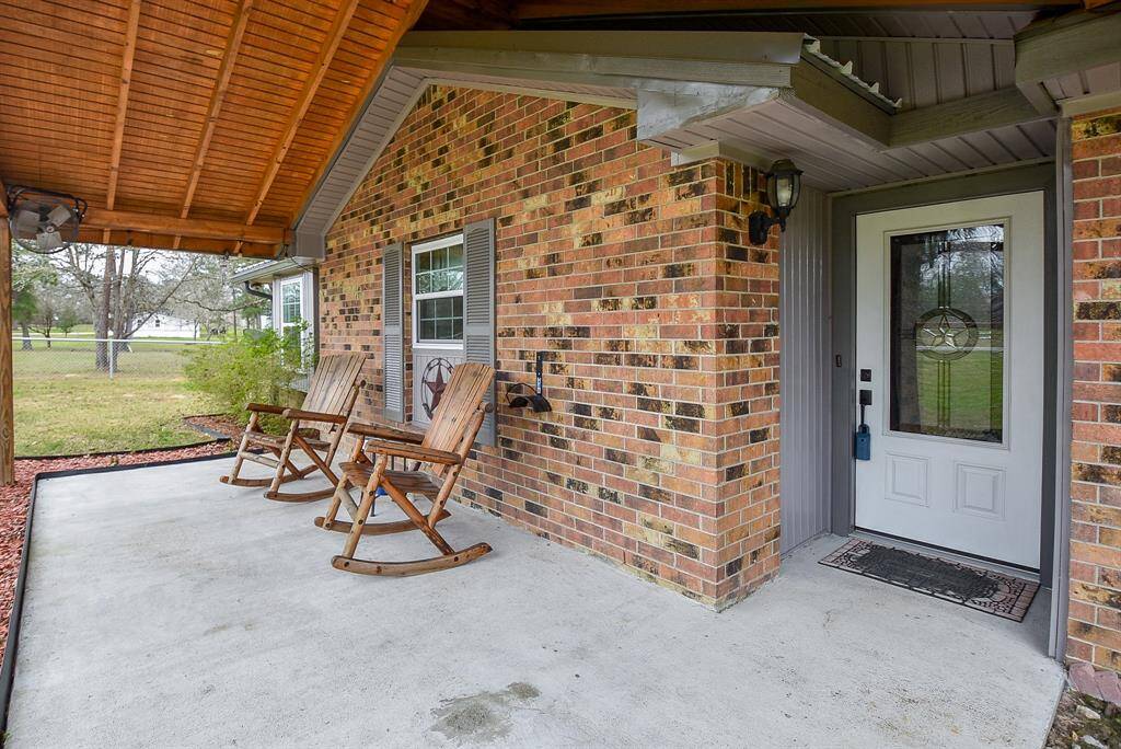 Gorgeous exterior window treatments invite an indoor look; with front door just footsteps away.
