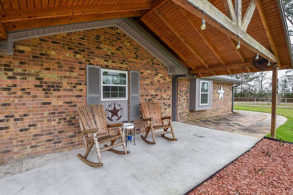 Cozy, comfy wooden rockers are perfect out here on a huge, covered patio.