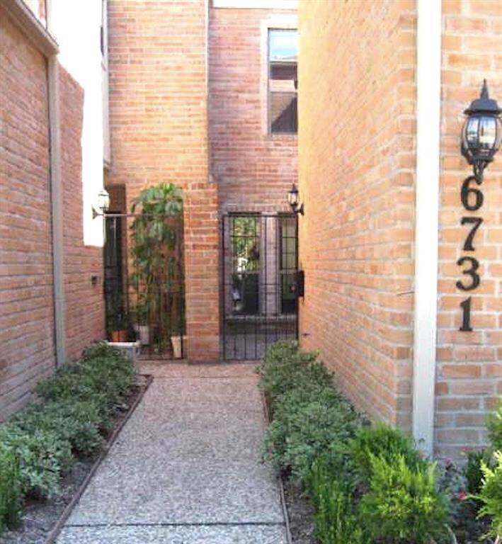 Welcome! The gated entry to the right secures the private courtyard for 6731 Vanderbilt.